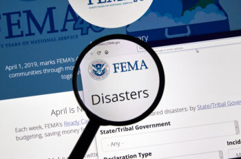 MONTREAL, CANADA - APRIL 24, 2019 : Fema.gov Disasters USA Government home page under magnifying glass. FEMA is The Federal Emergency Management Agency